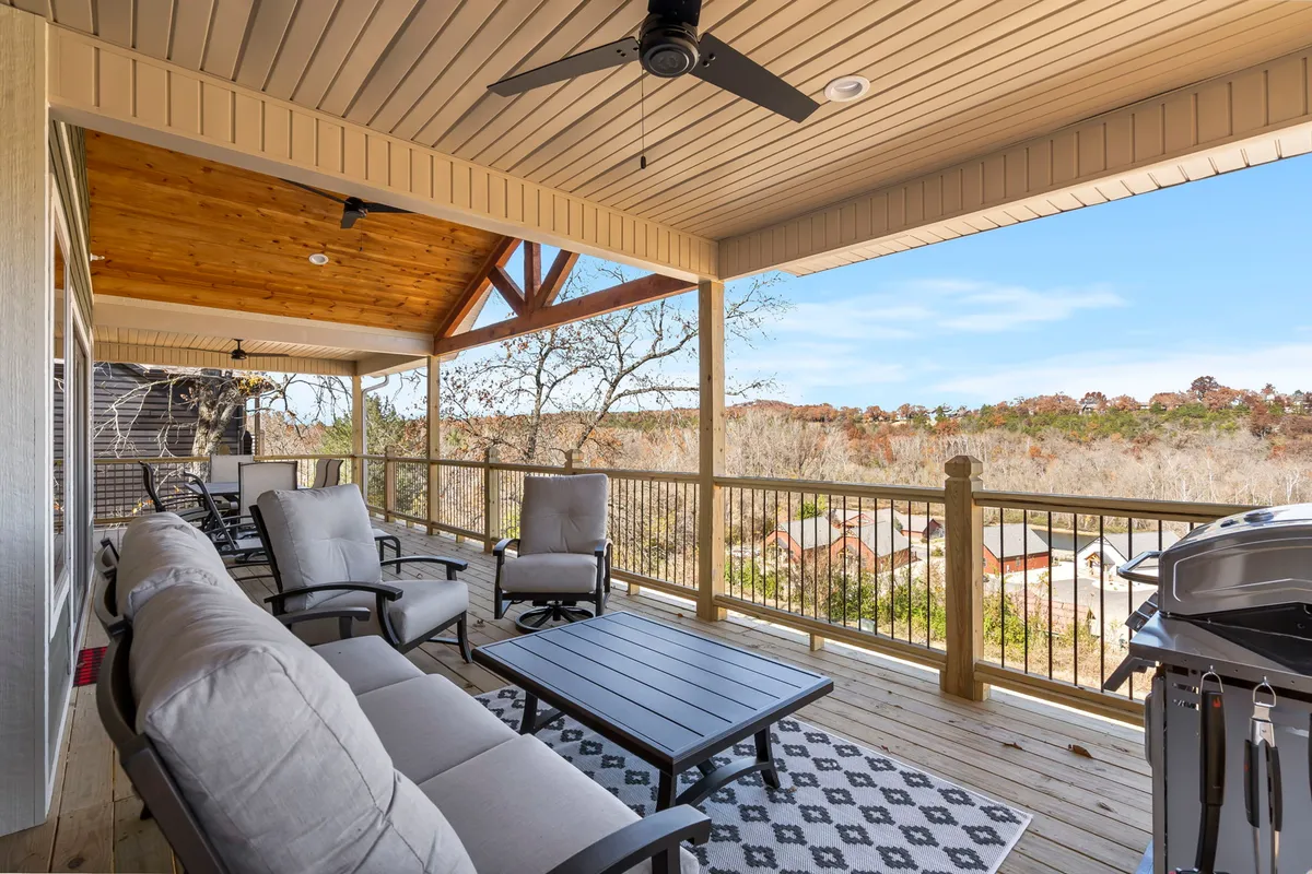 This exterior image features a comfortable outdoor seating area with an inviting grill and a scenic view, perfect for gatherings and barbecues. The space is designed for relaxation and socializing, with ample room for friends or family to enjoy the outdoors together.